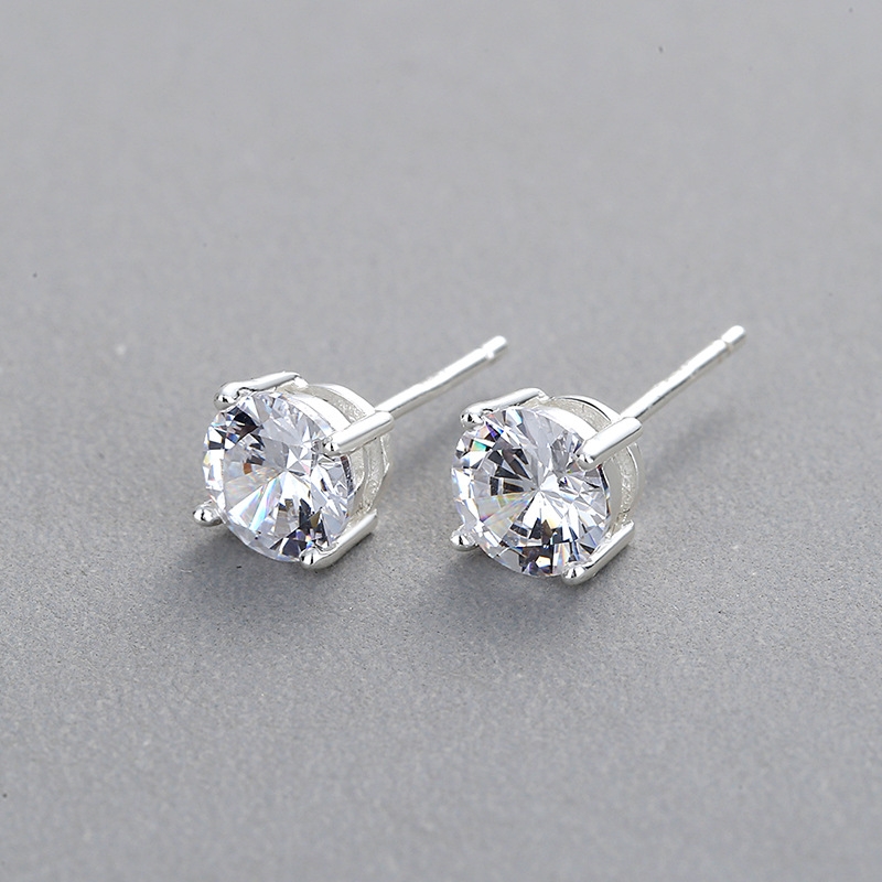 2 Ohrstecker (d=4mm) aus 925 Sterling Silber mit einem runden Zirkonia, 18k Weißgold vergoldet